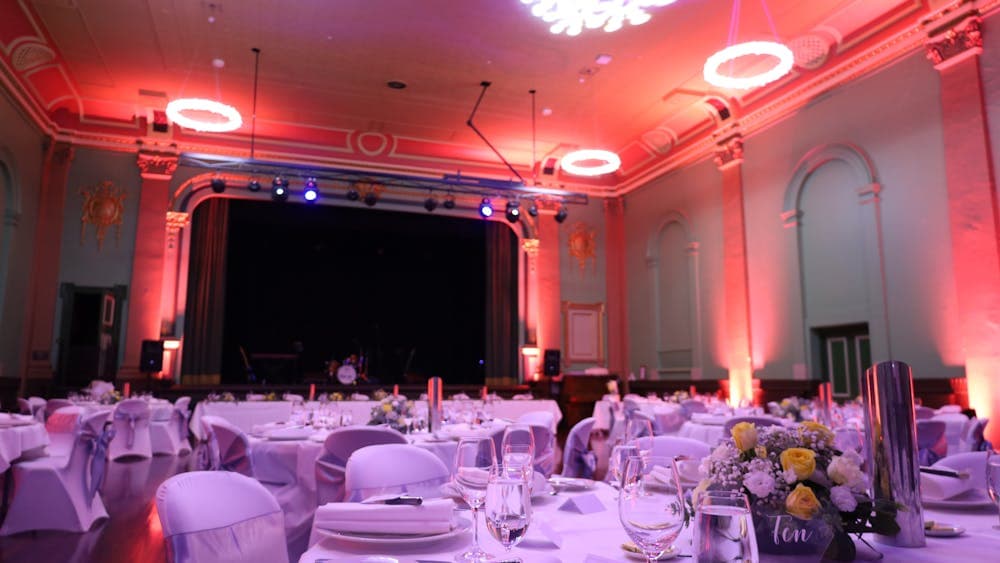 BMI Minerva Space set up for a formal function with round tables covered by white tablecloths