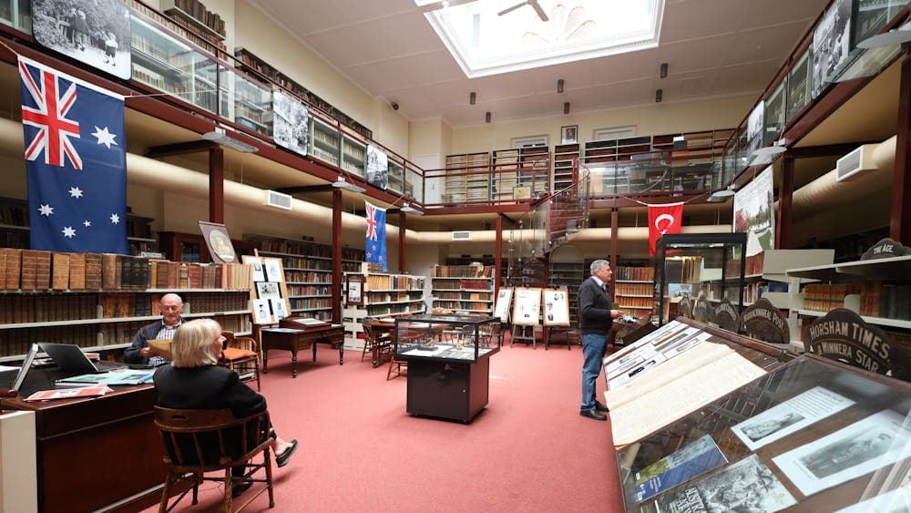 Photo of large room with books around the wall and a sunroof