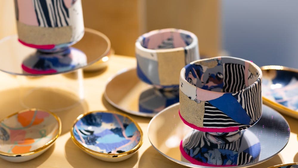 Colourful ceramic plates and bowls with gold.