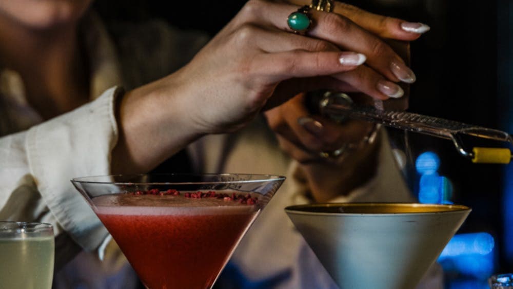 Mixologist preparing drinks