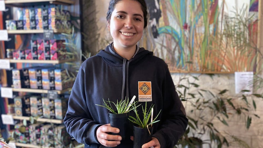 Woman holding plants