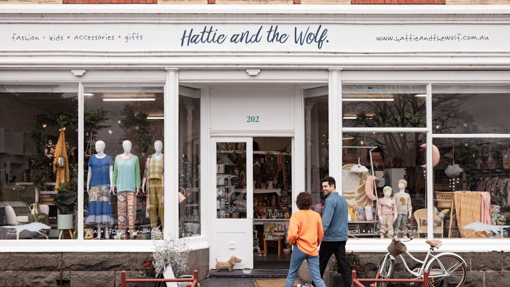 couple entering shop front of Hattie and the Wolf