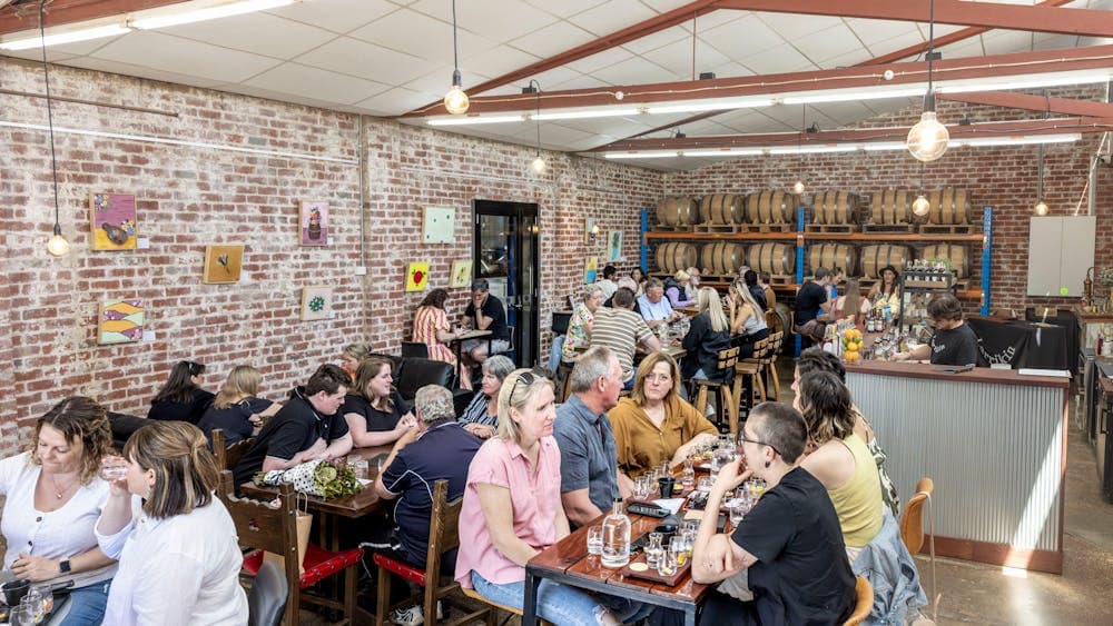 Venue filled with people seated at tables