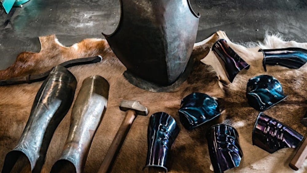 Armoury on display on animal skin on table