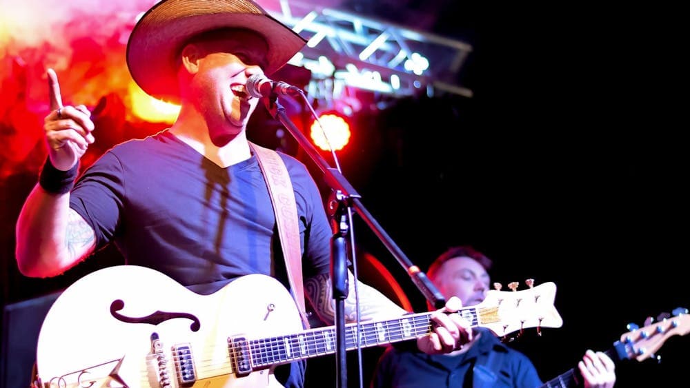 Cush Ryder mid-song at National Rodeo Championships