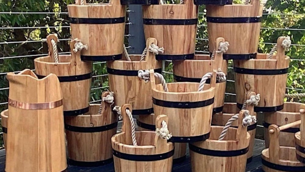 Group of buckets and barrel gathered together