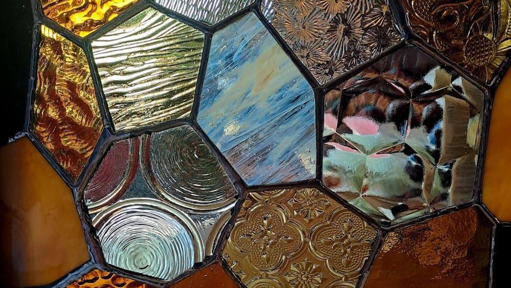 Close up of tiles on a boxed frame lamp