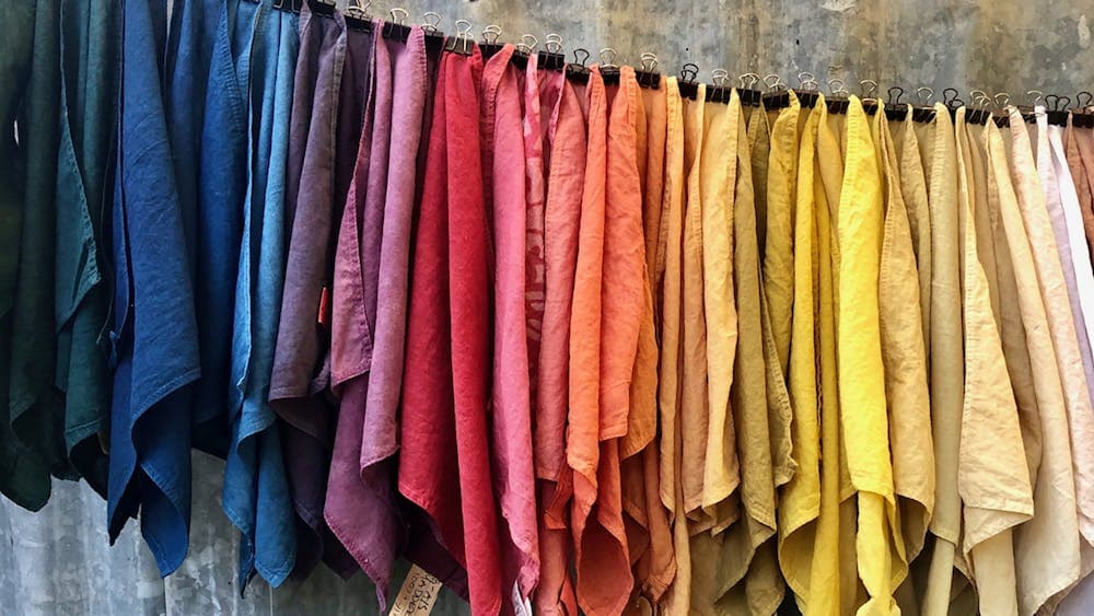 Various coloured fabrics hanging