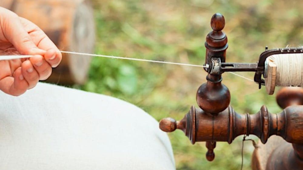 Spinning yarn on wheel