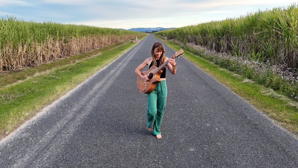 Majelen on promo picture for her long way to go tour in the cane fields in northern New South Wales