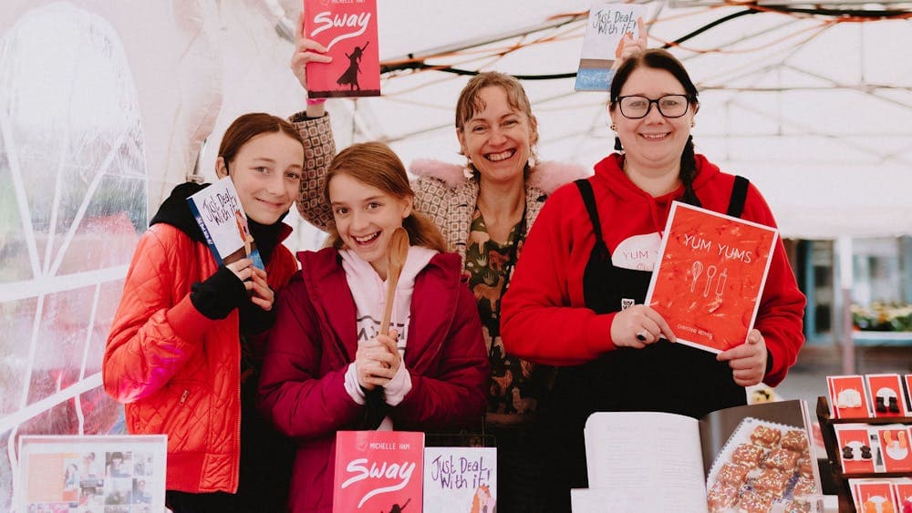 Group of people holding books