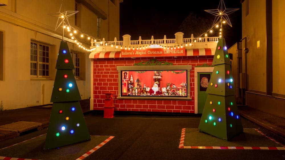 The Magical Christmas Emporium and Christmas Trees are lit up at night