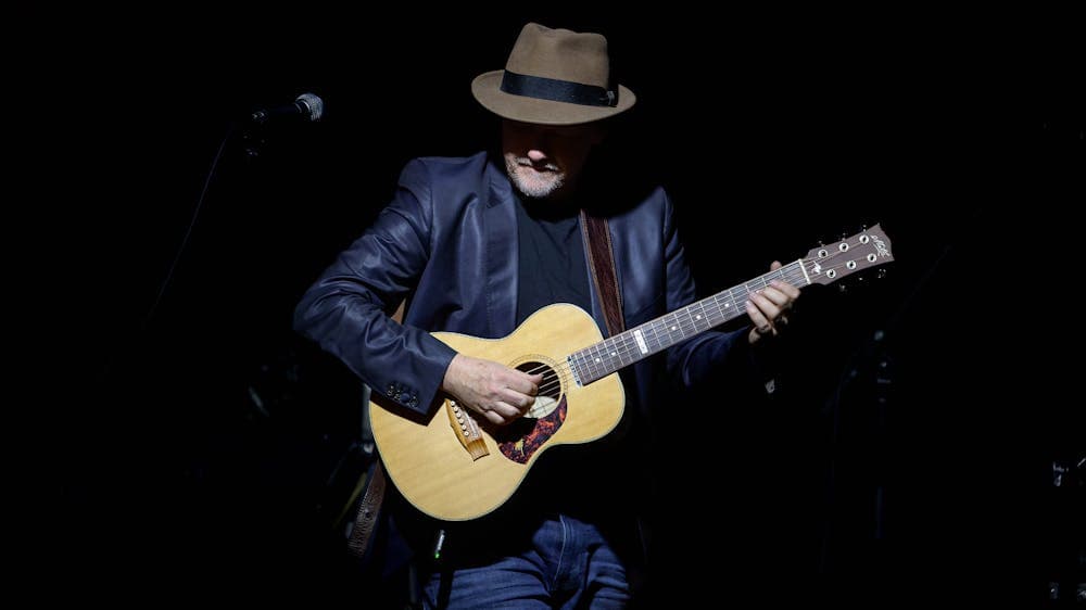 musician with acoustic guitar