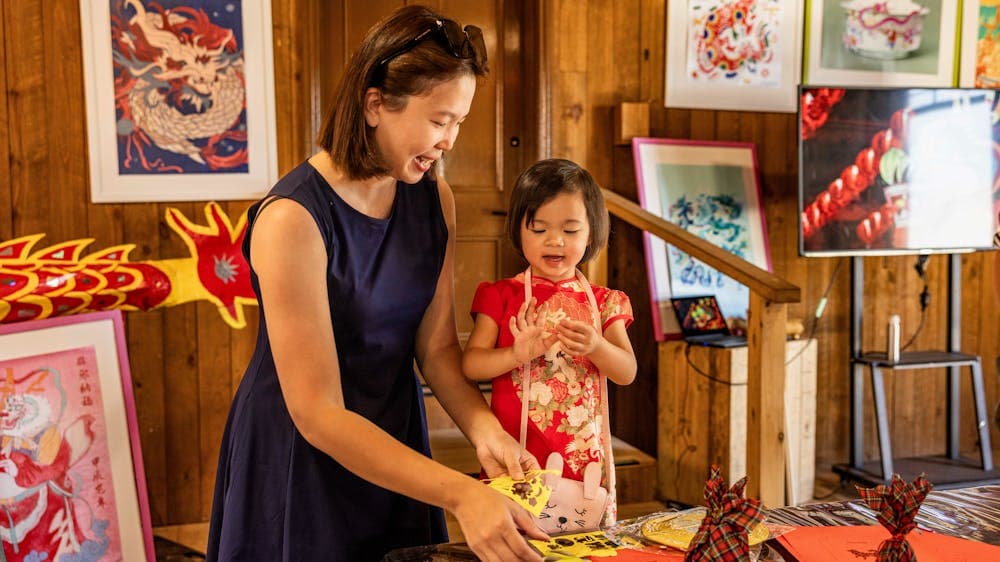 Mother and young daughter doing crafts