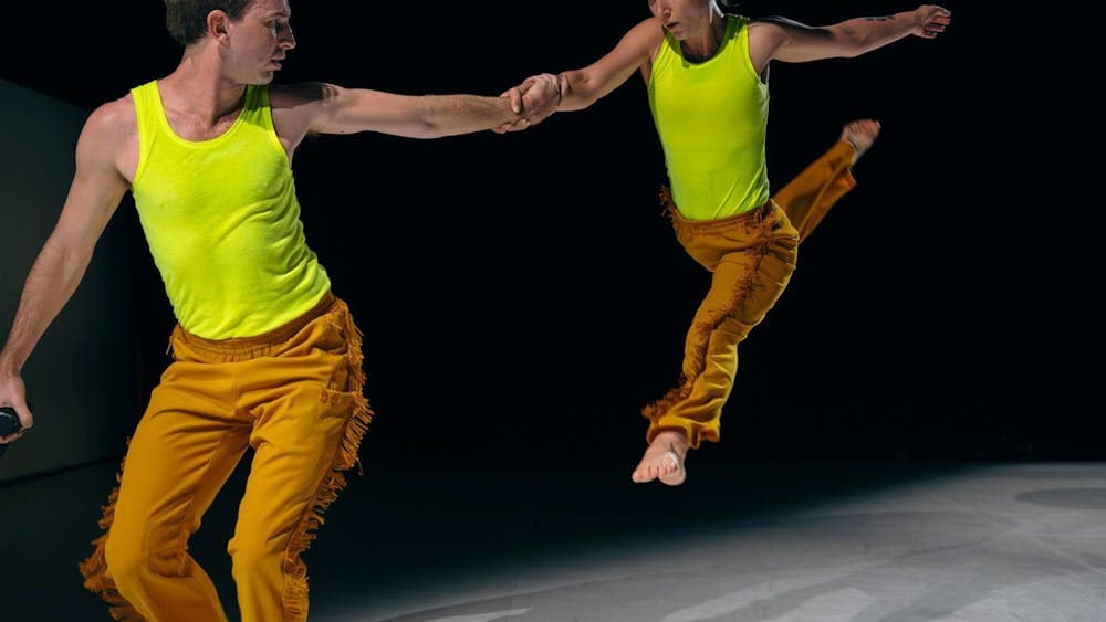 Dancers leaping through the air