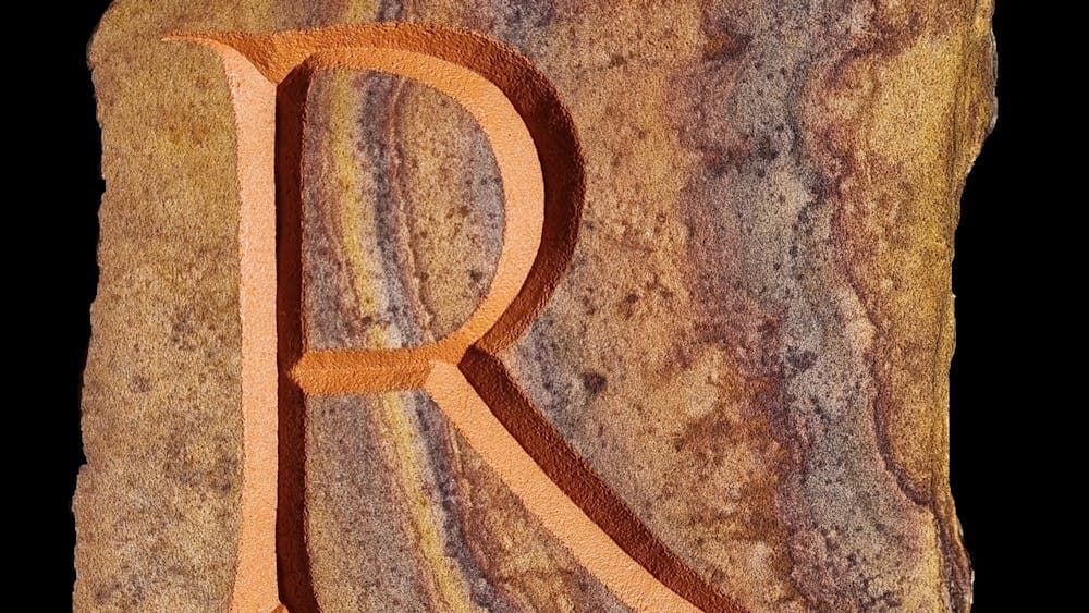 Letter R carved into stone