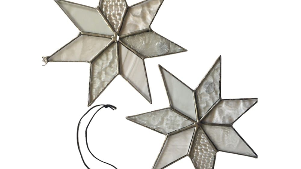 Two star-shaped glass window ornaments