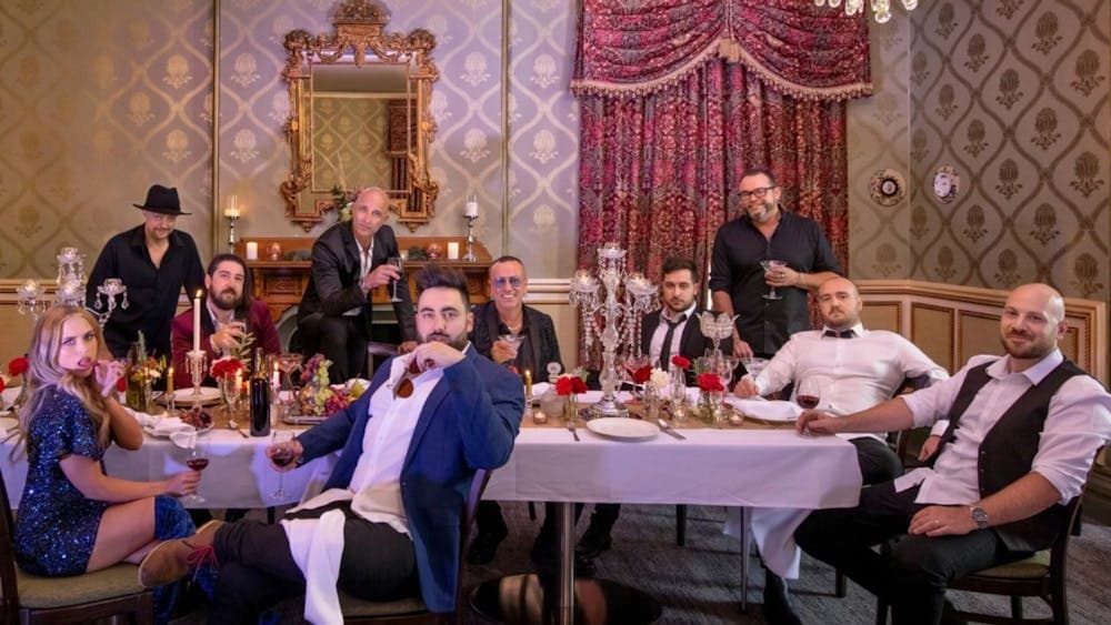 The members of Hindley Street Country Club lounging in an opulent room