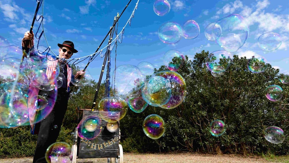 Dr Hubble Bubble blowing large bubbles in the garden