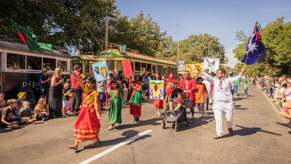 The Bangladeshi Community in Ballarat group walking in the parade wearing bright traditional clothes