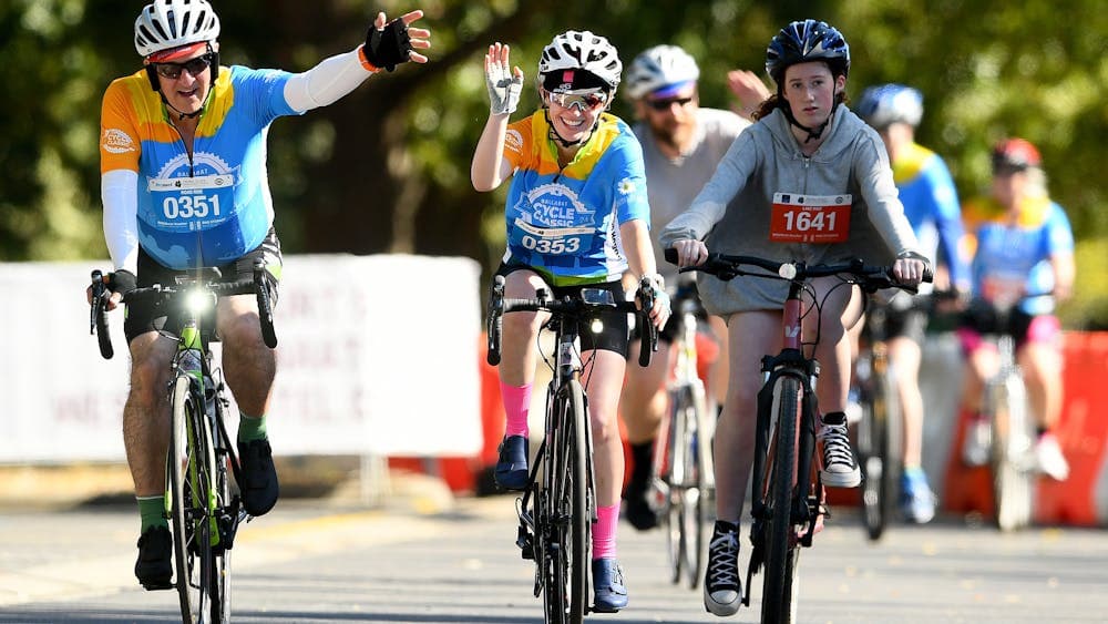 cyclists in the 85km road event enjoy reaching the finish ilne