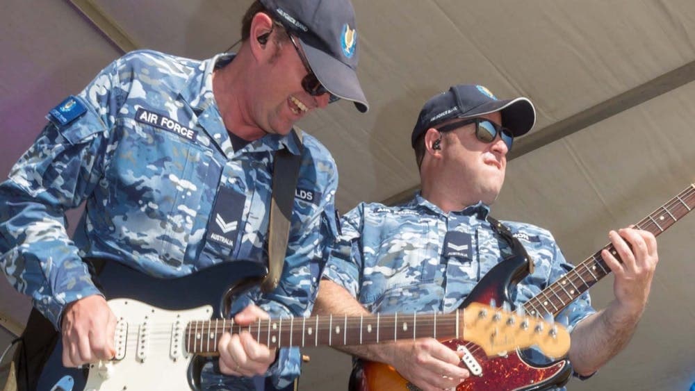 Air Force Band playing guitar on stage