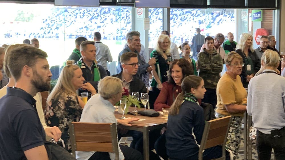 People congregating at tables for social purposes