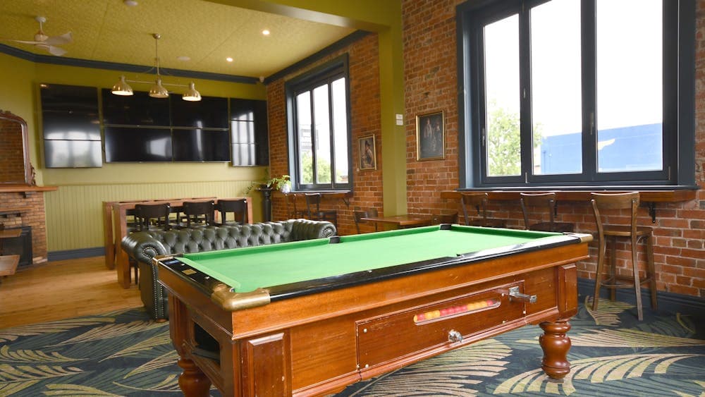 Sports bar with TVs and pool table