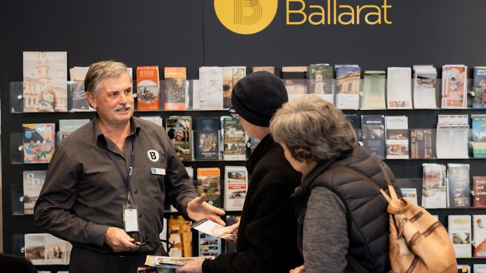 A volunteer serving visitors