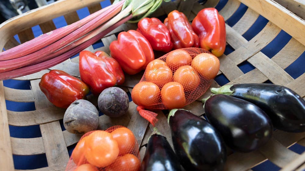 Clockwise from top left are: Rhubarb, Red capsicum, Orange tomatoes, Black eggplants and Beetroots