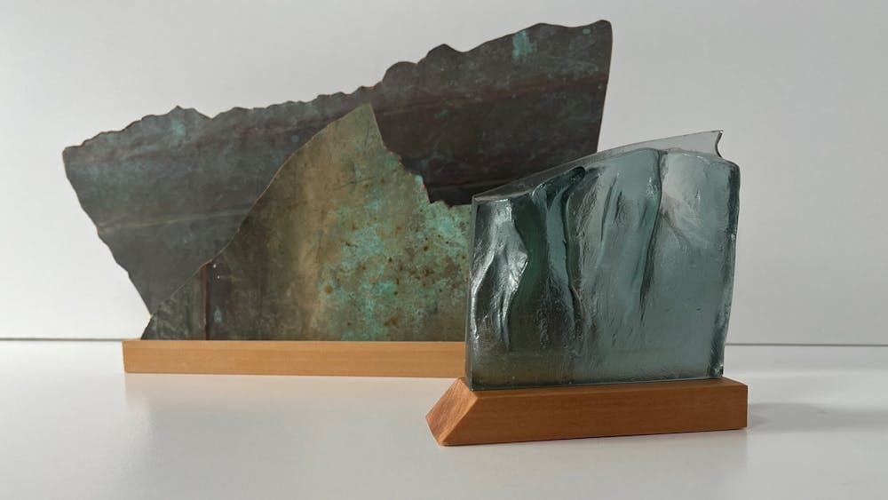 2 Sculpture consisting of two pieces made of copper, timber and cast glass.