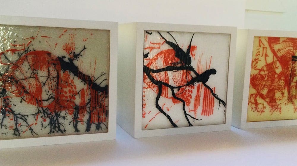 Three boxed panels, timber, screen printed and kiln formed glass .