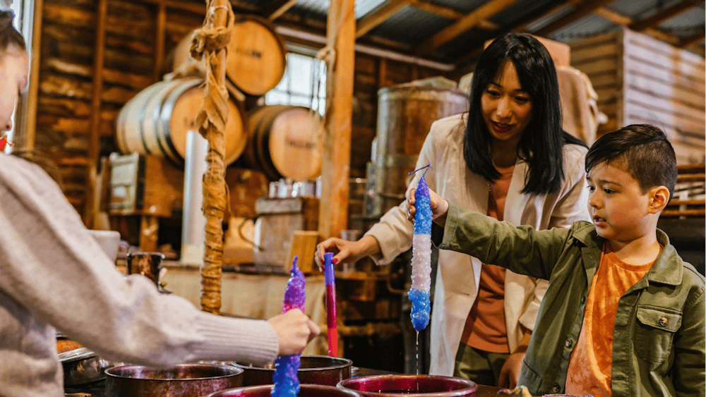 Mum and daughter candle dipping